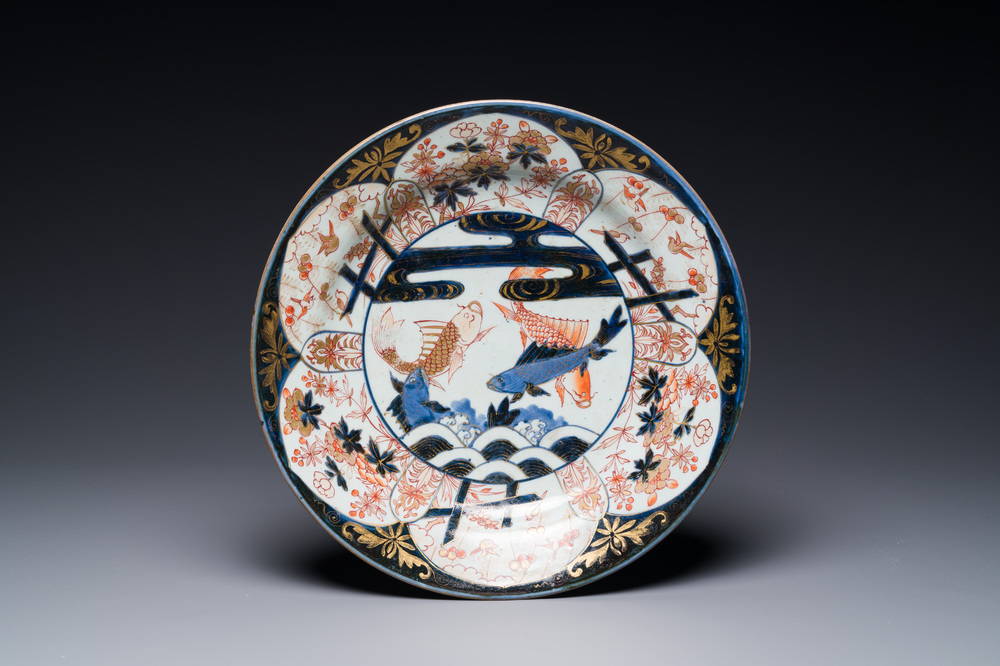 A Japanese Imari dish with carps among waves and clouds, Edo, 17th C.