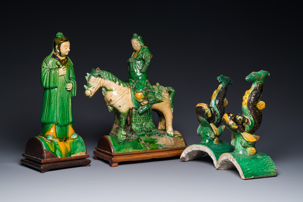 A pair of Chinese sancai roof tiles in the shape of a fish, a warrior on horseback and a sage, Ming