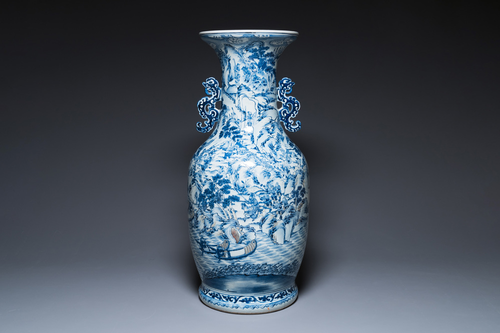 A large Chinese blue, white and copper-red vase with a mountainous river landscape, 19th C.