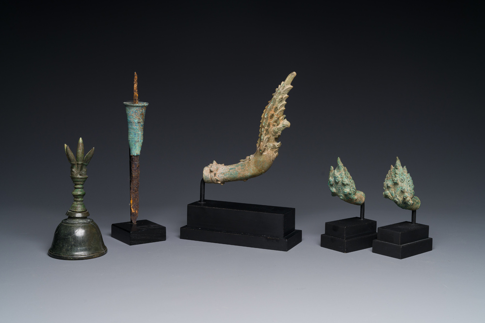 A various collection of bronze khmer palanquin hooks, a bell and a dagger, Angkor Wat periode, Thailand, 12th C.