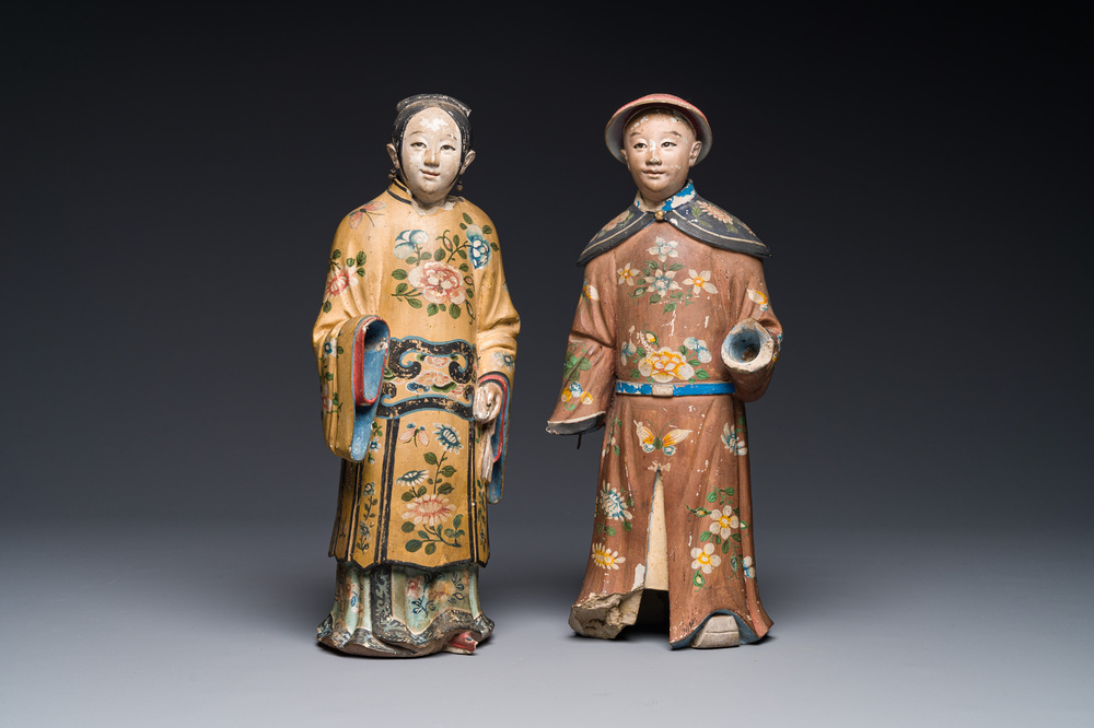 A pair of Chinese export polychrome decorated clay nodding head figures, 18/19th C.