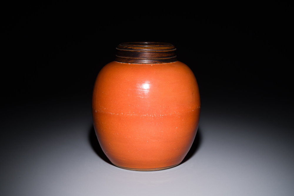 A Chinese monochrome coral-red-glazed ginger jar with wooden cover, 18th C.