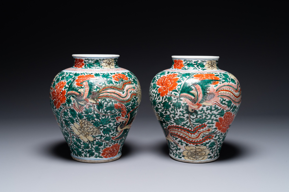 A pair of Chinese wucai 'phoenix and peony scroll' vases, Transitional period