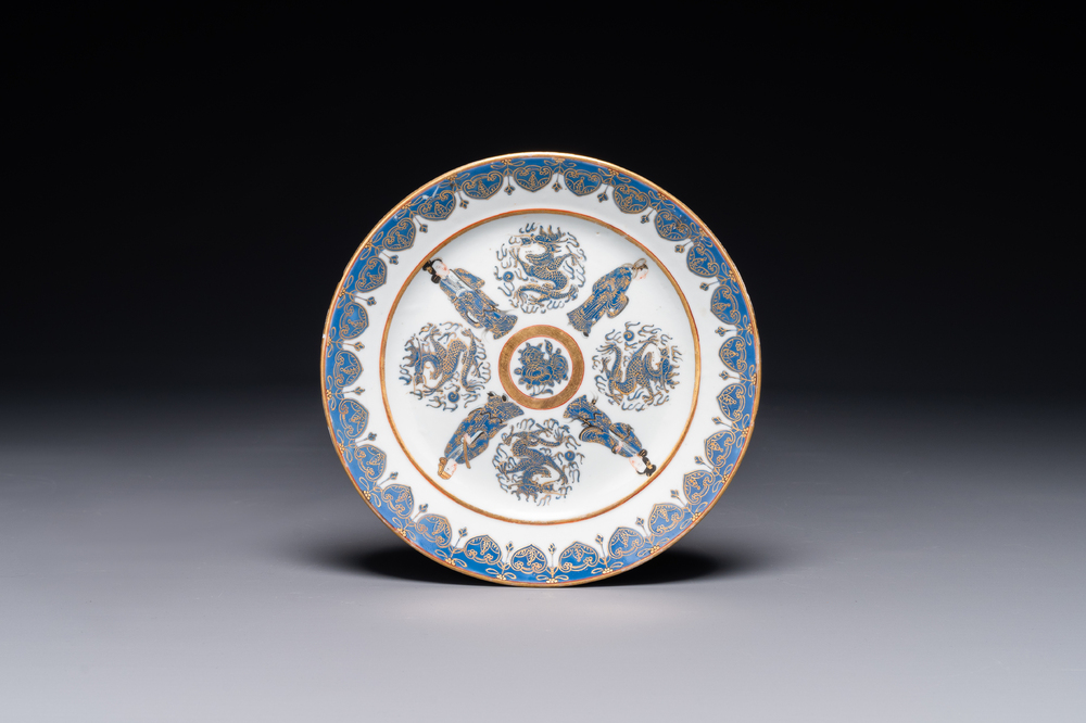A Chinese Canton gilt-decorated and blue-enameled plate with figures and dragons, 19th C.