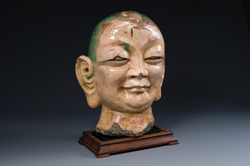 An imposing Chinese sancai glazed stoneware head of a monk, Yuan/Ming