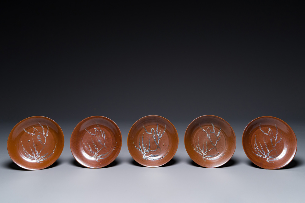 Five Chinese slip-decorated brown-glazed 'bird on blossoming plum tree' plates, Fujian kilns, late Ming, 16/17th C.