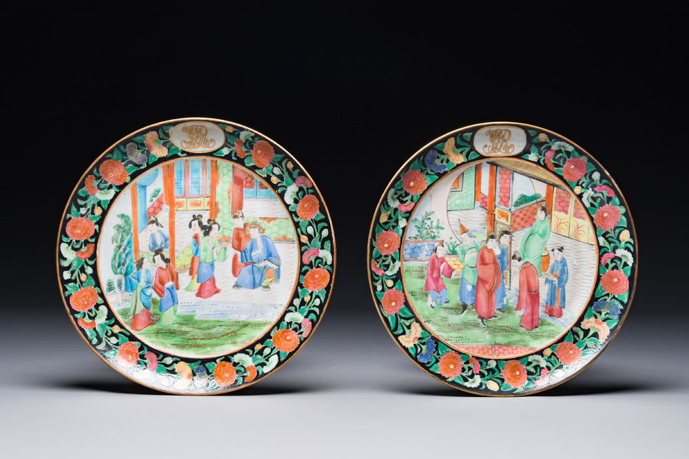 A pair of Chinese monogrammed Canton famille rose plates with black-glazed rims, 19th C.