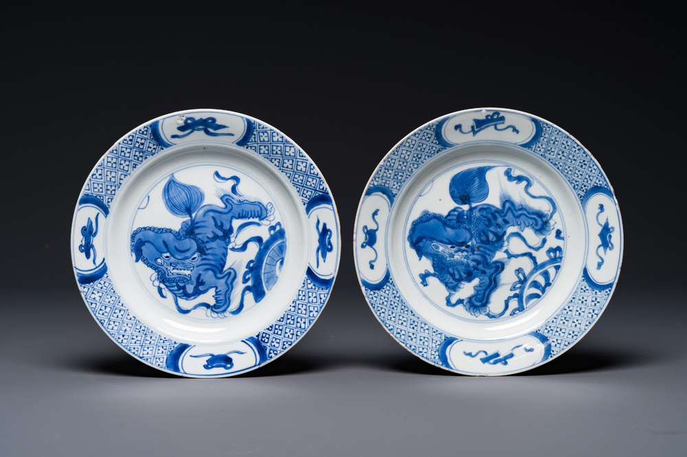 A pair of Chinese blue and white 'Buddhist lion' plates, ding mark, Kangxi