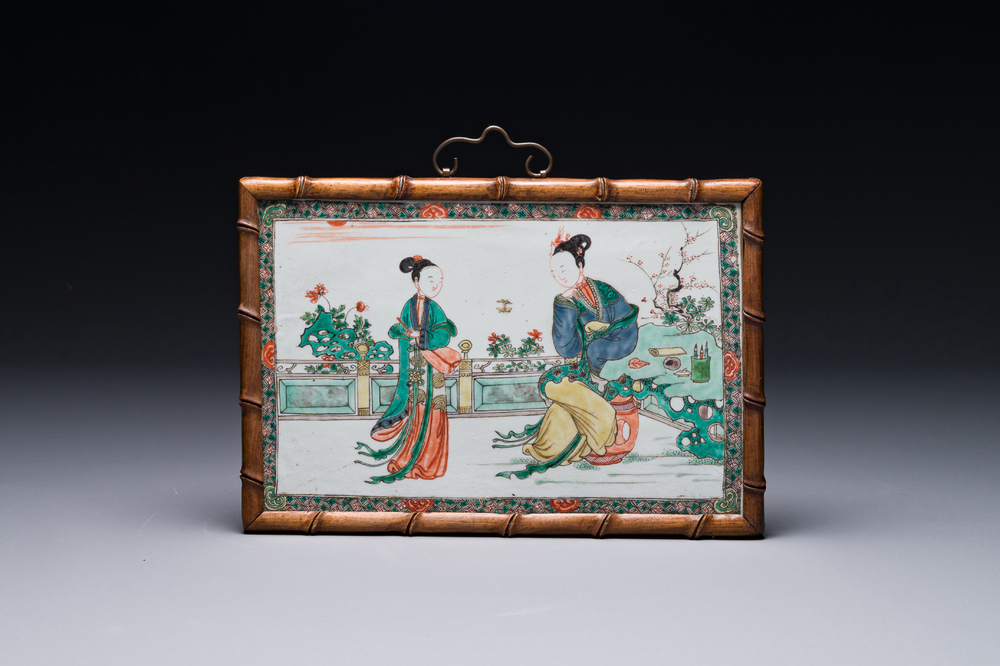 A rectangular Chinese famille verte plaque in a wooden faux bamboo frame, Kangxi