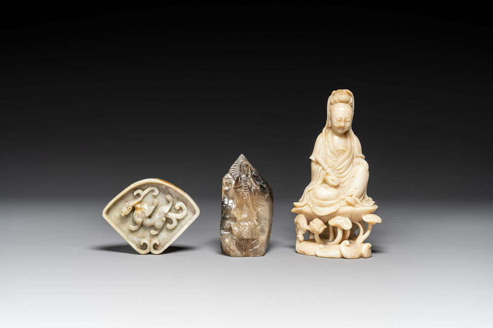 A Chinese soapstone and a crystal figures of Guanyin and a jade 'chilong' plaque, 19th C.