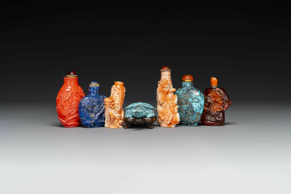 Seven varied Chinese snuff bottles of precious stone, red coral, glass and amber, 19th C.