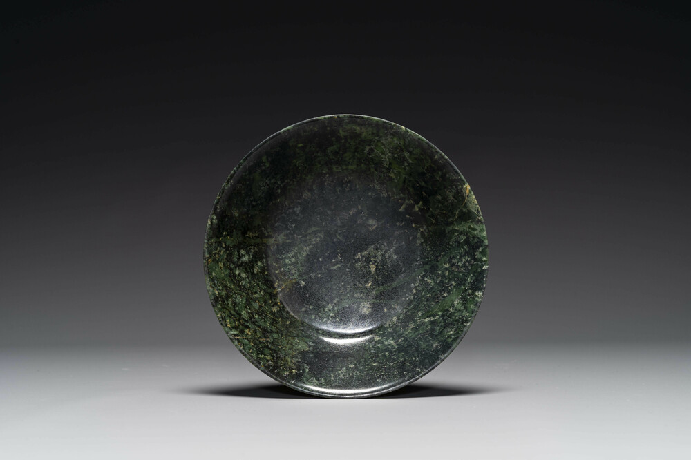 A Chinese dark green jade bowl, 18th C.
