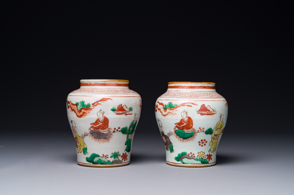 A pair of small Chinese wucai jars with figures in a landscape, Transitional period