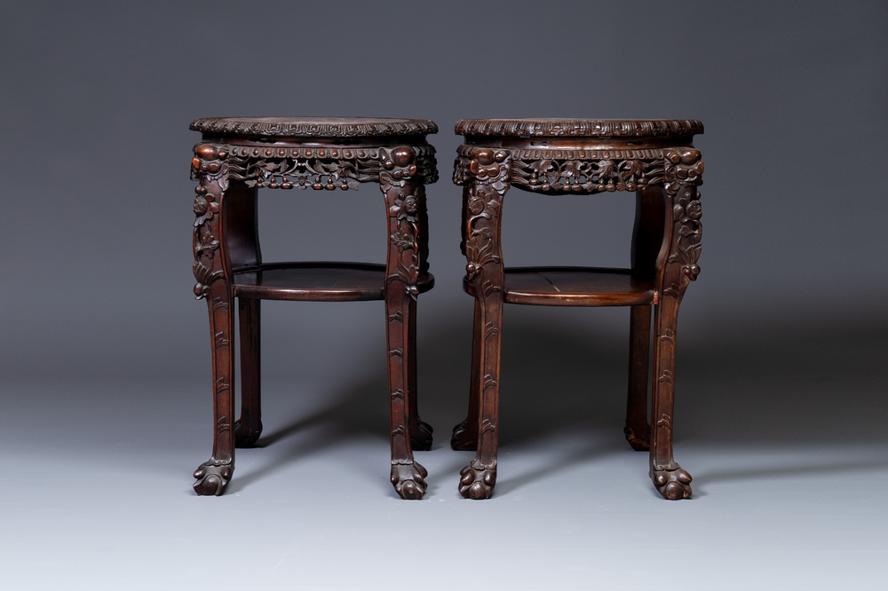 A pair of large Chinese carved wooden stands with marble tops, 19th C.
