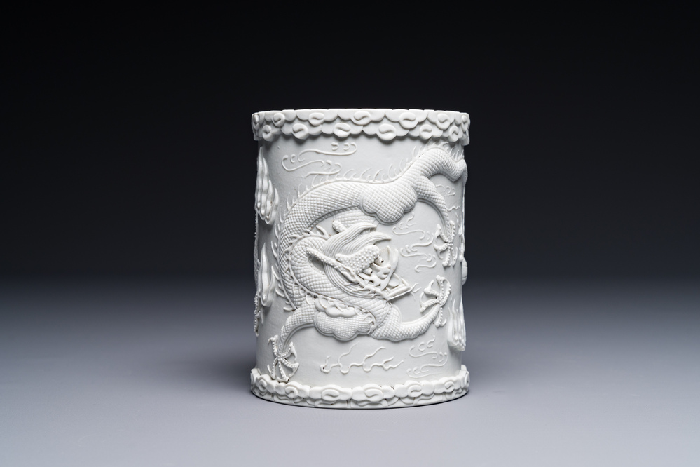 A Chinese monochrome white-glazed biscuit brush pot, signed Wang Bingrong 王炳榮, 19/20th C.