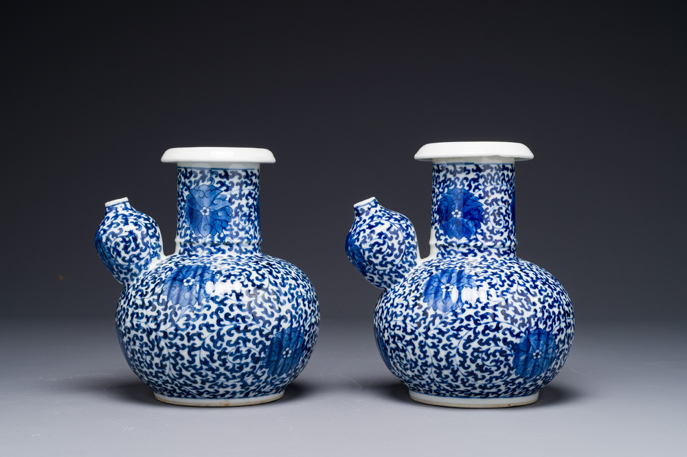 A pair of Chinese blue and white 'lotus scroll' kendis, 19th C.