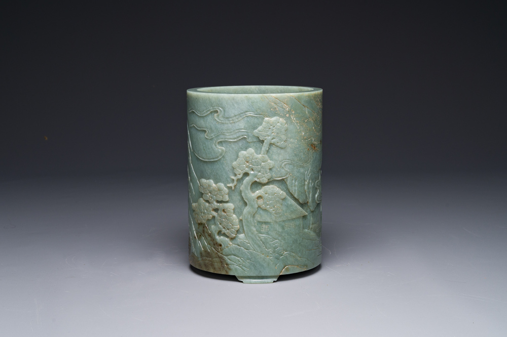 A Chinese spinach jade brush pot with relief design, 18th C.