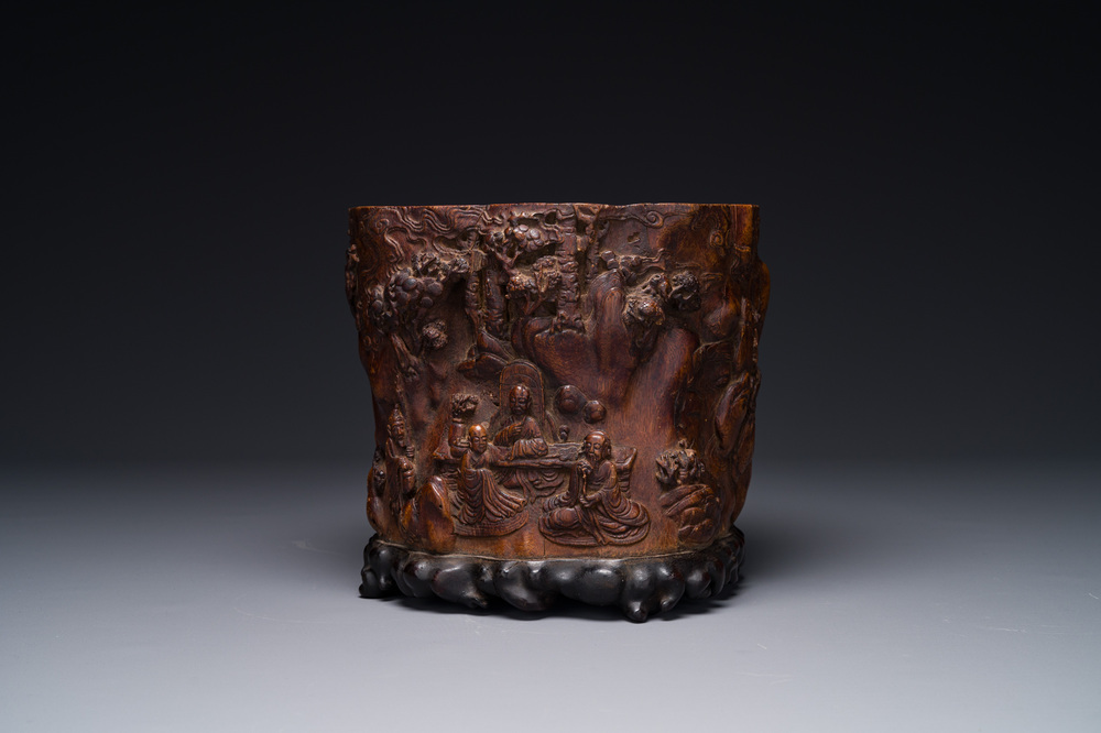 A large Chinese carved huanghuali wooden brush pot with Taoist design, 17/18th C.