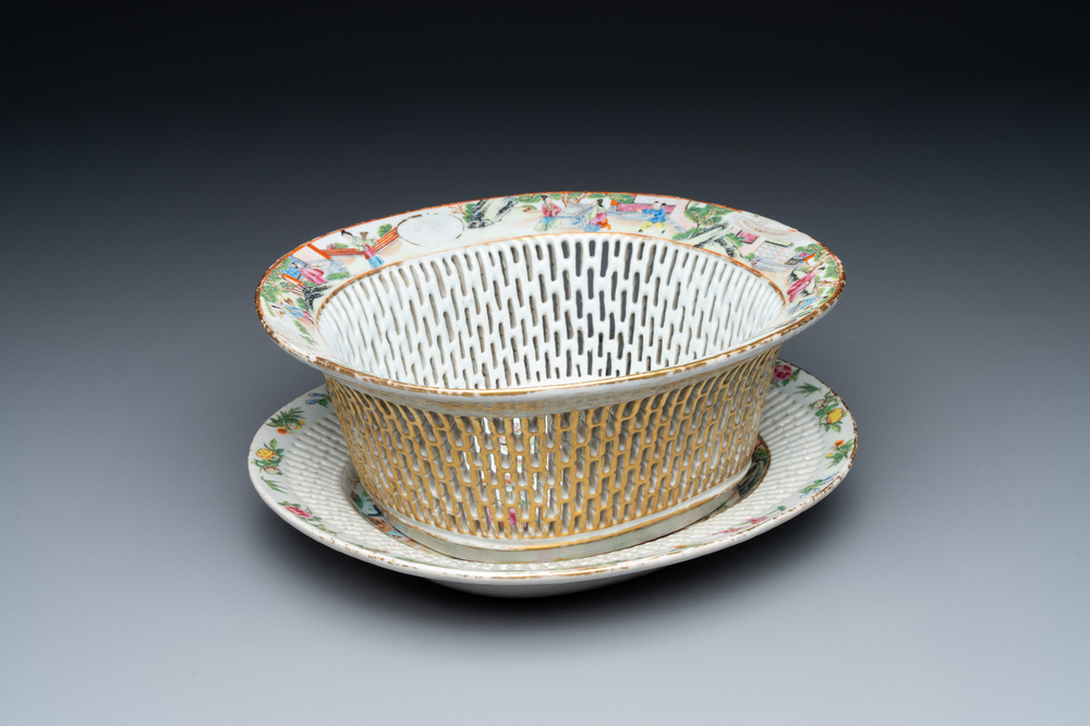 A Chinese Canton famille rose reticulated basket and stand, 19th C.