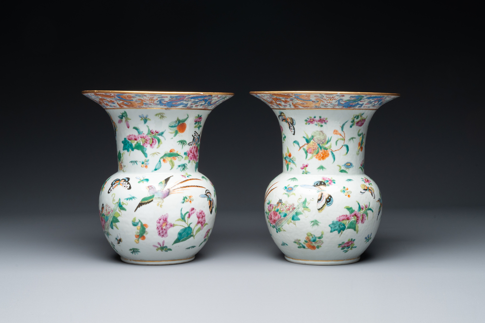 A pair of Chinese Canton famille rose spittoons with dragons, birds, butterflies and flowers, 19th C.