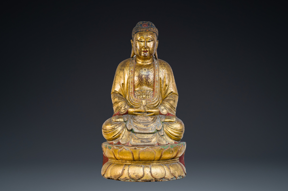A large Chinese or Vietnamese polychromed and glit wooden Buddha, 19th C.