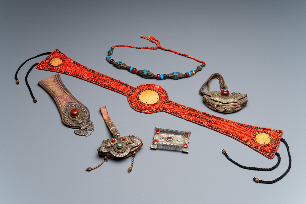 A group of six Tibetan objects of metals and textiles with gem stones, 19th C.