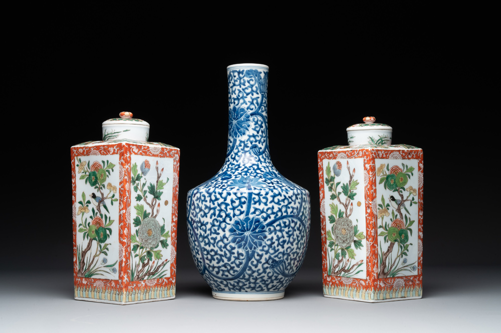 A Chinese blue and white bottle-shaped 'lotus scroll' vase and a pair of square famille verte flasks and covers, 19th C.