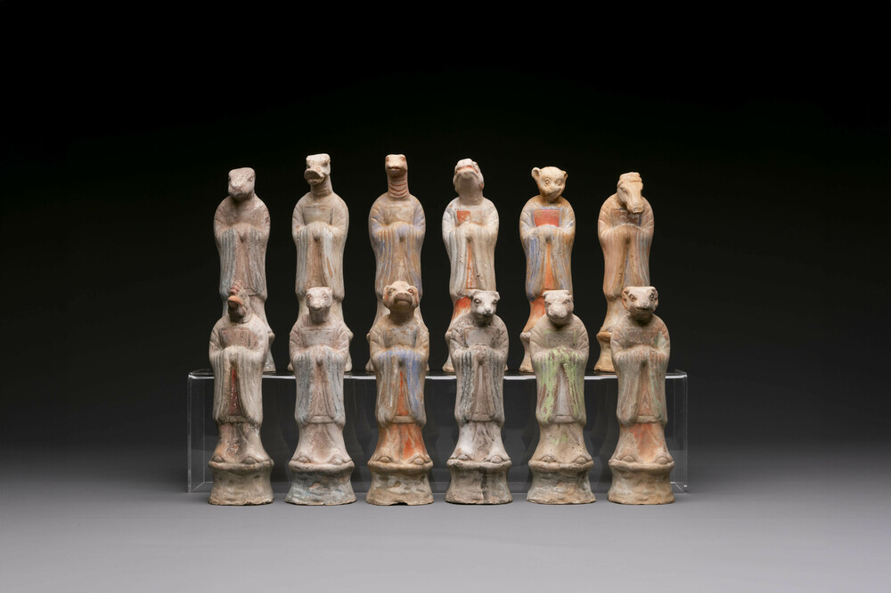An impressive set of 12 Chinese cold painted terracotta zodiac figures, Ming