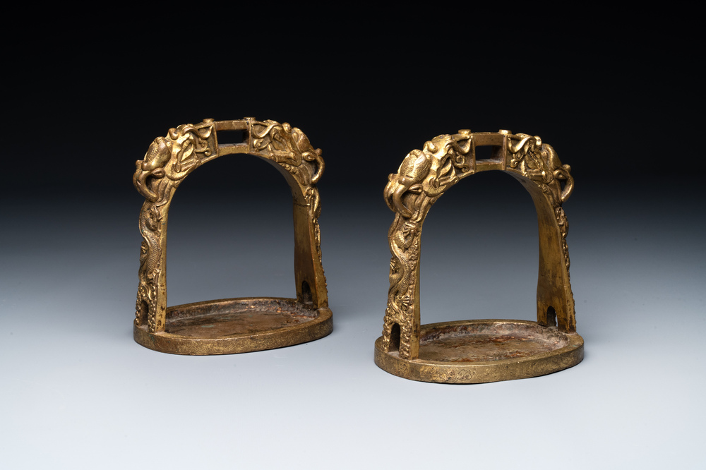 A pair of Chinese imperial gilt-bronze stirrups with dragons, De 德 mark, 18th C.