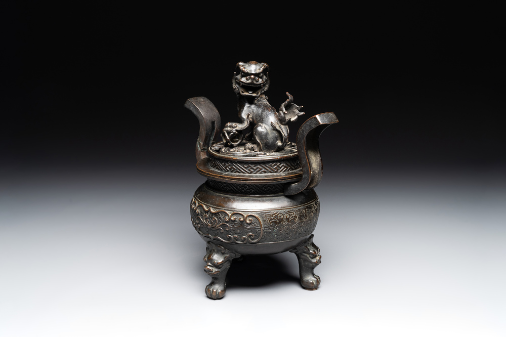 A large Chinese bronze censer and cover with a Buddhist lion, Ming