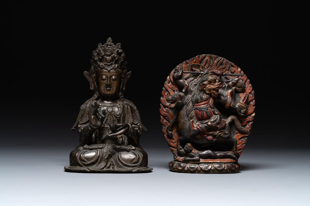 A Chinese bronze Guanyin, Ming and a Tibetan polychrome plaster relief, 19th C.