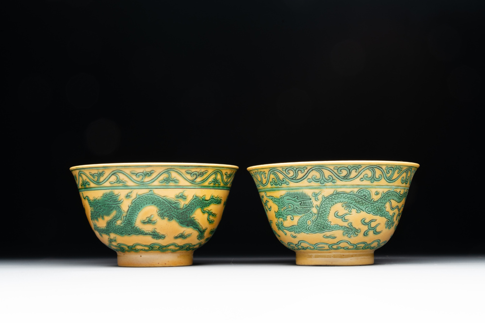 A pair of Chinese yellow-ground 'dragon' and 'shou' bowls, Guangxu mark and of the period
