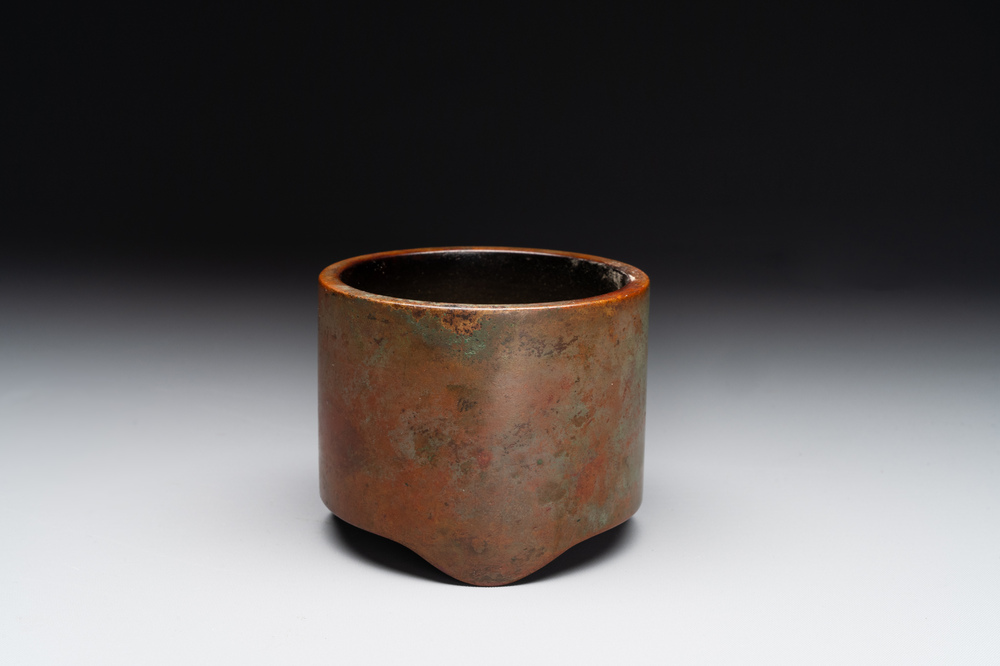 A small Chinese bronze cylindric tripod censer, Xuande mark, Ming