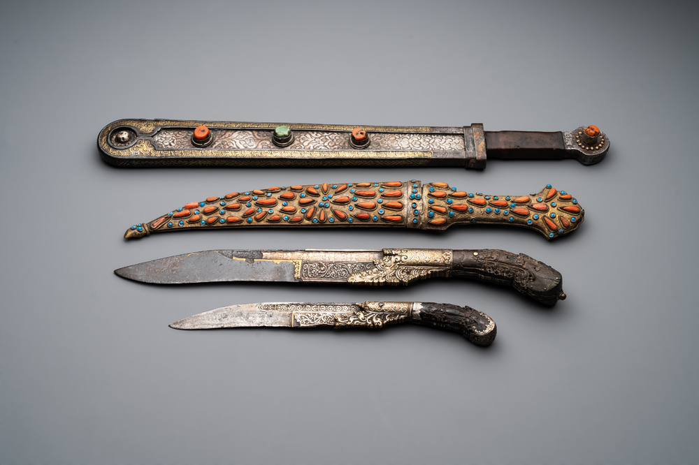 A varied collection of four decorated daggers, two inset with red coral and turquoise, Sri Lanka and Georgia, 18/19th C.