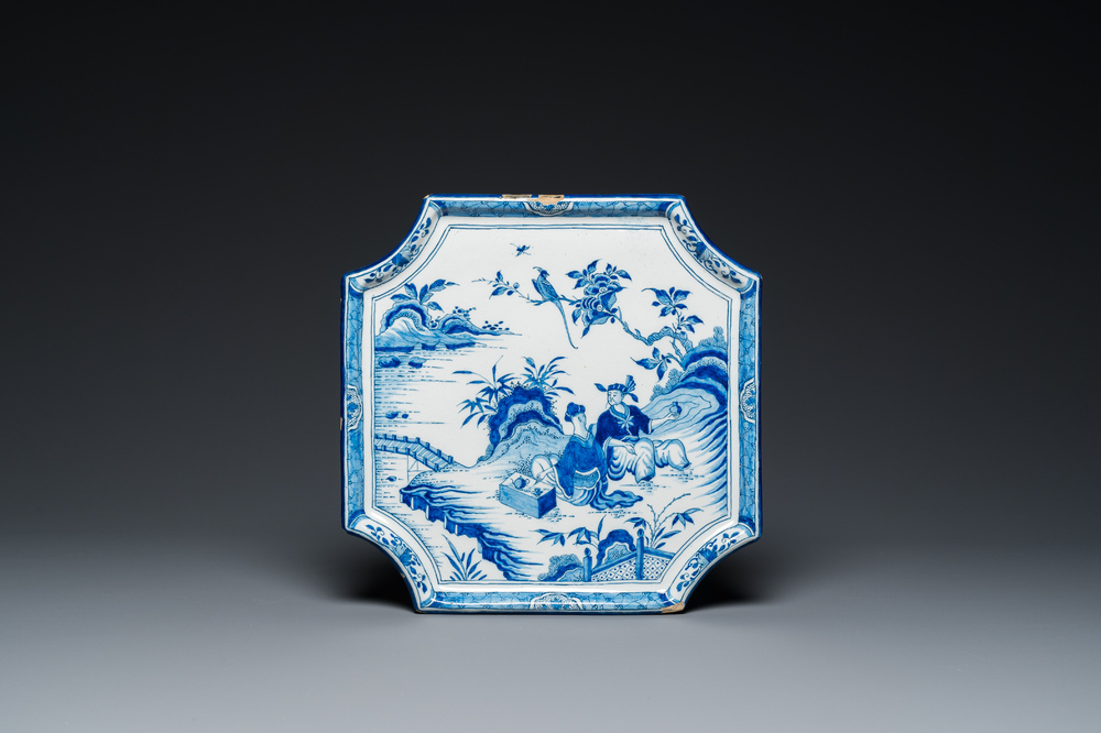 A blue and white Dutch Delft chinoiserie plaque with a tea drinking scene, 18th C.