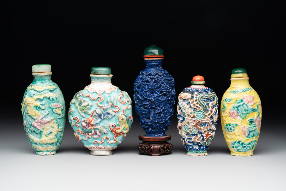 Five Chinese moulded famille rose snuff bottles, Qianlong mark, 19th C.