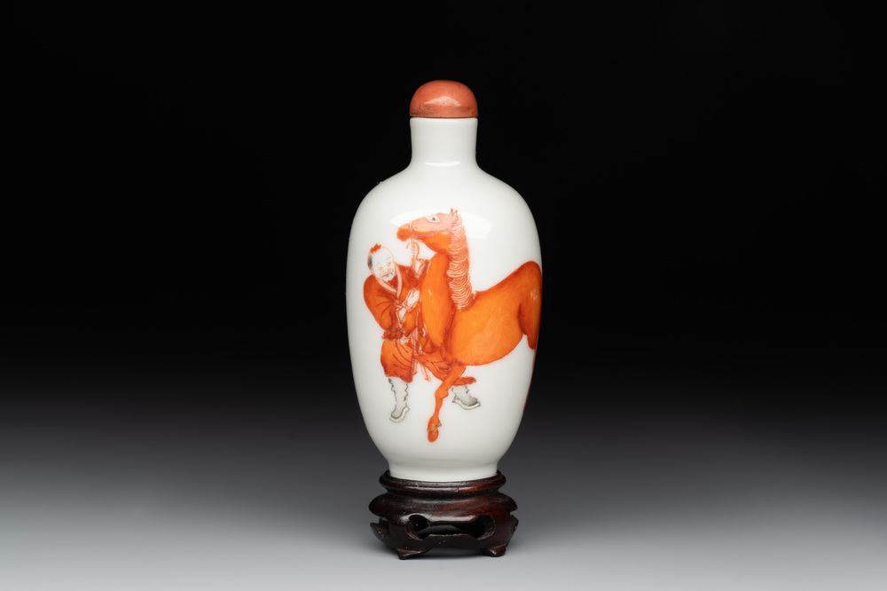 A fine Chinese iron-red and grisaille 'horse and man' snuff bottle, 19th C.