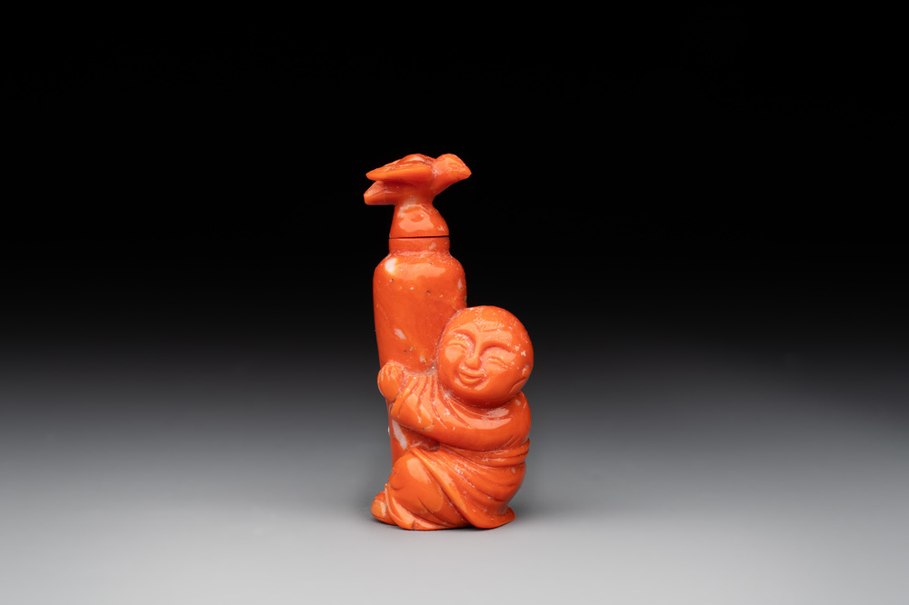 A Chinese carved red coral 'boy and vase' snuff bottle and stopper, 19th C.
