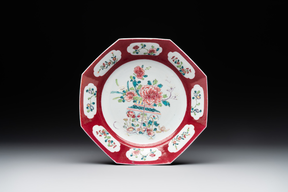 A Chinese octagonal famille rose ruby border plate with a flower basket, Yongzheng