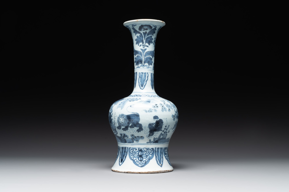 A blue and white Dutch Delft bottle-shaped chinoiserie vase with a lion, 17th C.