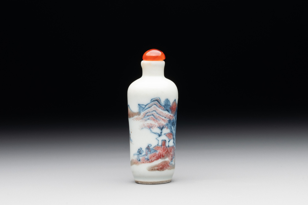 A Chinese blue, white and copper-red 'landscape' snuff bottle, 19th C.
