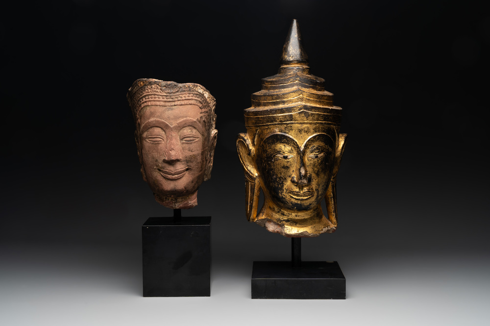A Thai red sandstone head of Buddha and a lacquered and gilt stone head of Buddha, possibly Ayutthaya period, 15th C.