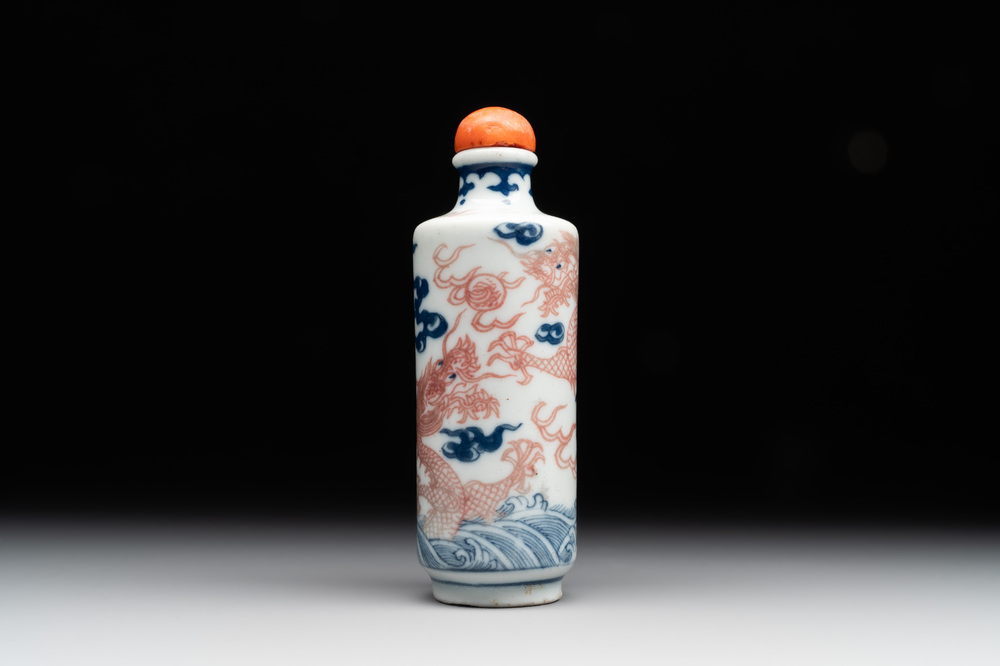 A Chinese blue, white and copper-red 'dragon' snuff bottle, 19th C.