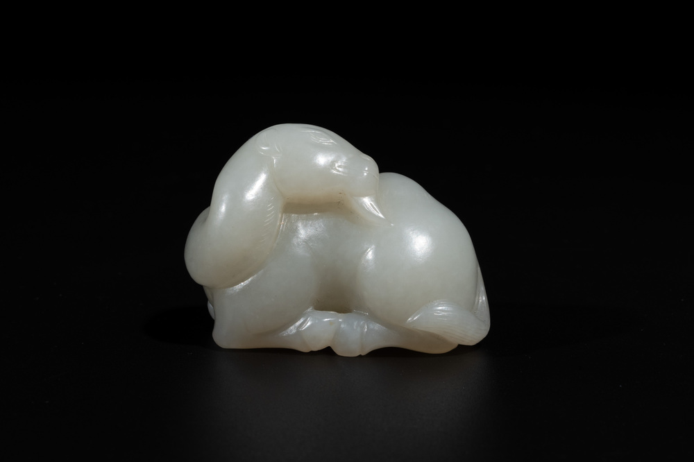 A Chinese white jade carving of a reclining camel, Qing