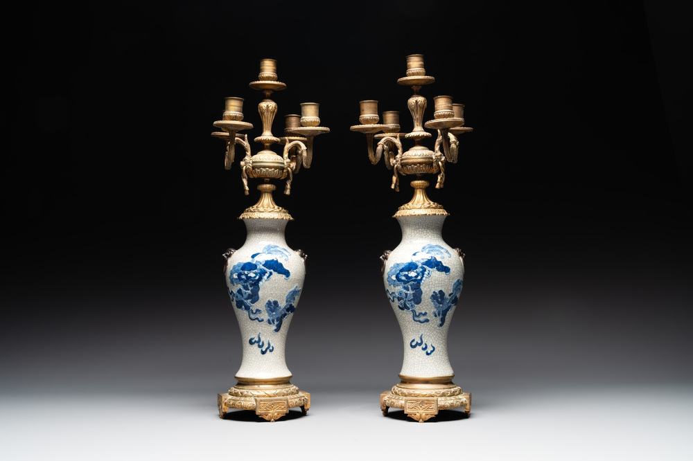 A pair of Chinese blue and white Nanking crackle-glazed vases with gilt bronze candelabra mounts, 19th C.