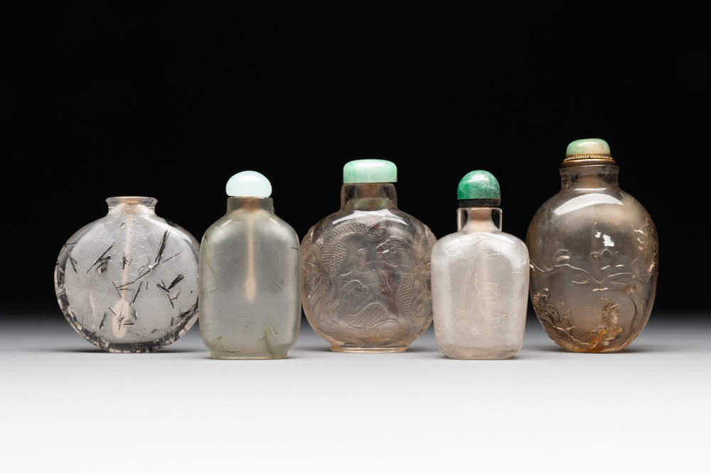 Five Chinese rock crystal and needle agate snuff bottles, Qing