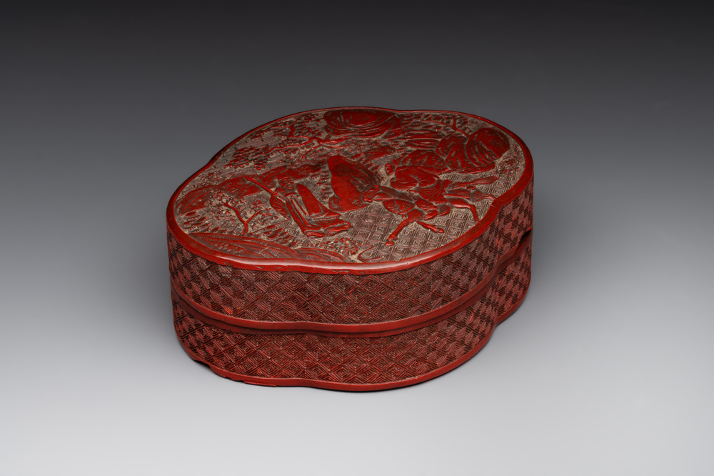 A Chinese quadrifoil red cinnabar lacquer box and cover with figural design, 19/20th C.