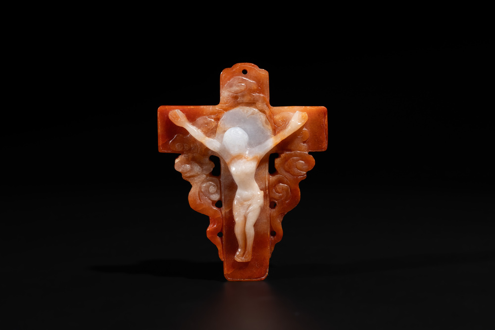 A Chinese white and red jade 'crucifix' pendant, 19th C.