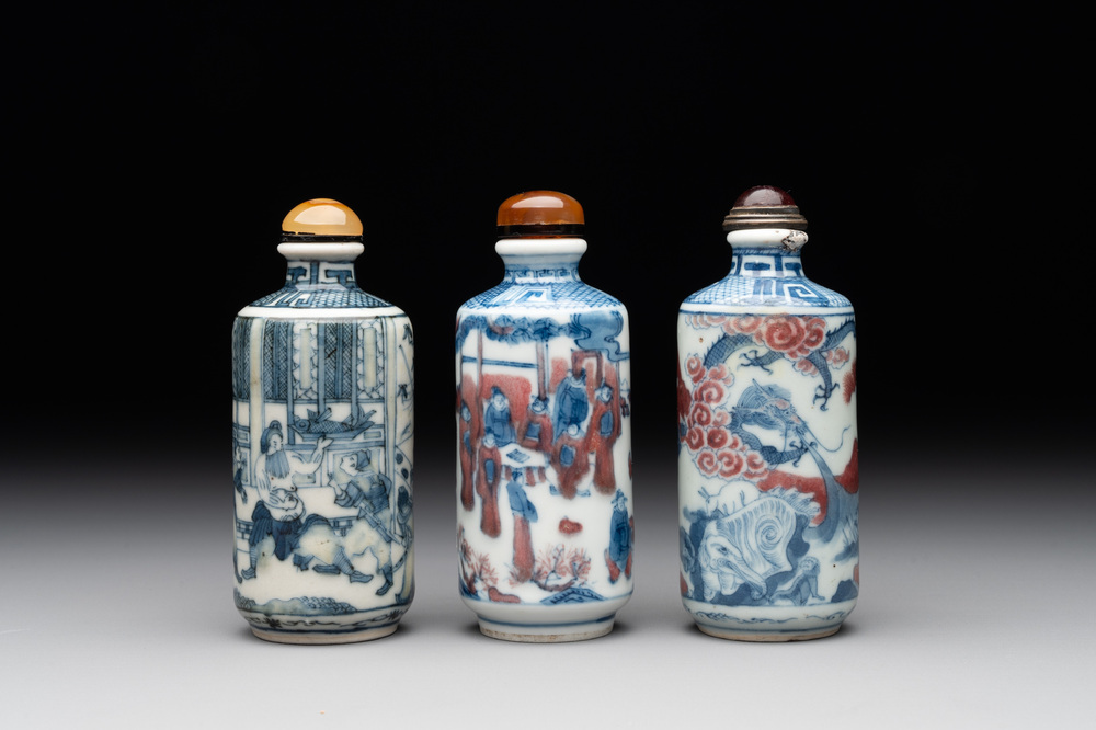 Three Chinese blue, white and copper-red snuff bottles, 19th C.