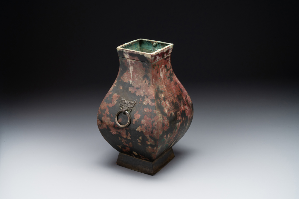 A Chinese archaic bronze vase with 'Taotie' handles, 'fang hu 方壺', Han